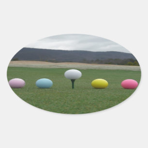 bright coloured Golf Balls on a mountain Oval Sticker