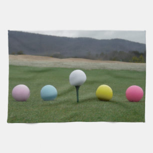 bright coloured Golf Balls on a mountain Tea Towel