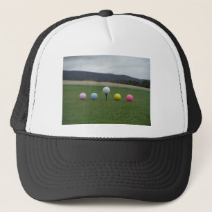 bright coloured Golf Balls on a mountain Trucker Hat