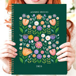 Bright Folk Art Floral Custom Name Planner<br><div class="desc">This cheerful design features a vibrant folk art-inspired floral pattern with colourful blooms in shades of pink, purple, orange, and white against a deep green background. The personalised name and year add a unique touch, making it perfect for students, professionals, or anyone who loves playful and artistic designs. Ideal for...</div>