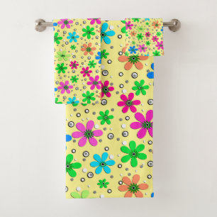 Bright multi-coloured chamomile flowers on a yello bath towel set