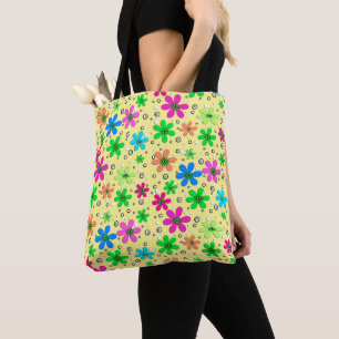 Bright multi-coloured chamomile flowers on a yello tote bag