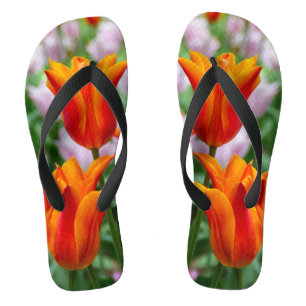 Bright orange tulips in the park flip flops