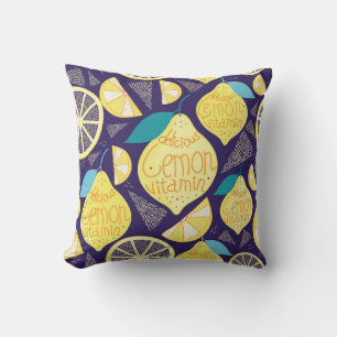 Bright pattern of lemons and cloves on a dark blue cushion