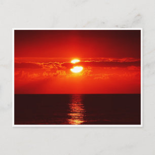 Bright Red Sunset Over the Ocean Postcard