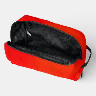 Bright red zippered pouch on a white background
