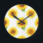 Bright Sunflower Watercolor Seamless Pattern Round Clock<br><div class="desc">Radiant joy in full bloom! This cheerful,  hand-painted watercolor pattern bursts with large,  golden sunflowers against crisp white,  each bloom detailed with warm amber centers,  soft petals,  and fresh green leaves. A timeless,  uplifting floral design that brings instant summer happiness and sunshine vibes.</div>