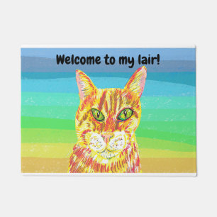 Brightly coloured ginger cat welcome to my lair doormat