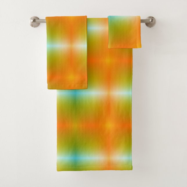 Brightly coloured towels hang on a silver bar (Insitu)