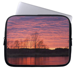 Brilliant sunset reflects into the Calamus River Laptop Sleeve