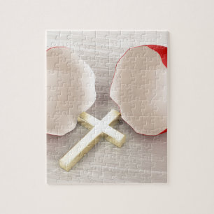 Broken eggshell and cross jigsaw puzzle