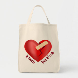 Broken heart healed with patch and life quote tote bag