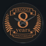 Bronze eighth wedding anniversary 8 years large clock<br><div class="desc">A design to celebrate 8 years of marriage. This design has a tan (bronze) coloured laurel design on a black background. Bronze is the traditional gift for this occasion, USA. The text reads BRONZE 8 years anniversary. A romantic design to celebrate your 8th year of marriage. If you would like...</div>