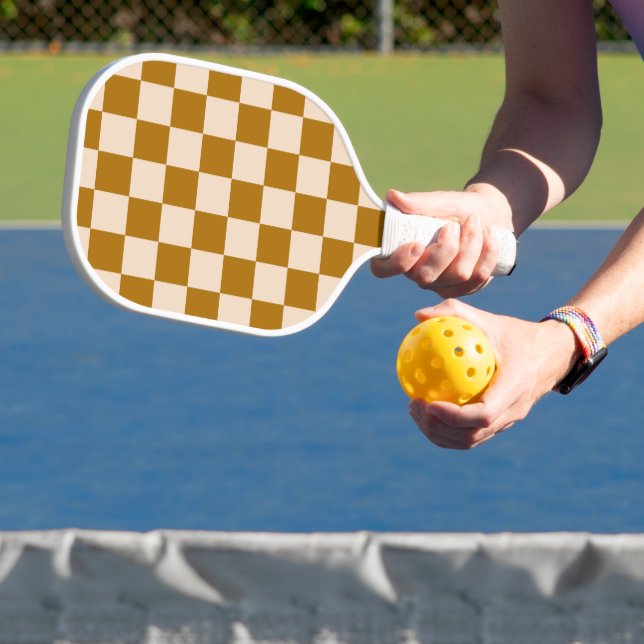 Brown and beige checkerboard pattern pickleball paddle (Insitu)