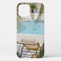 Brown and black armchair beside swimming pool in t