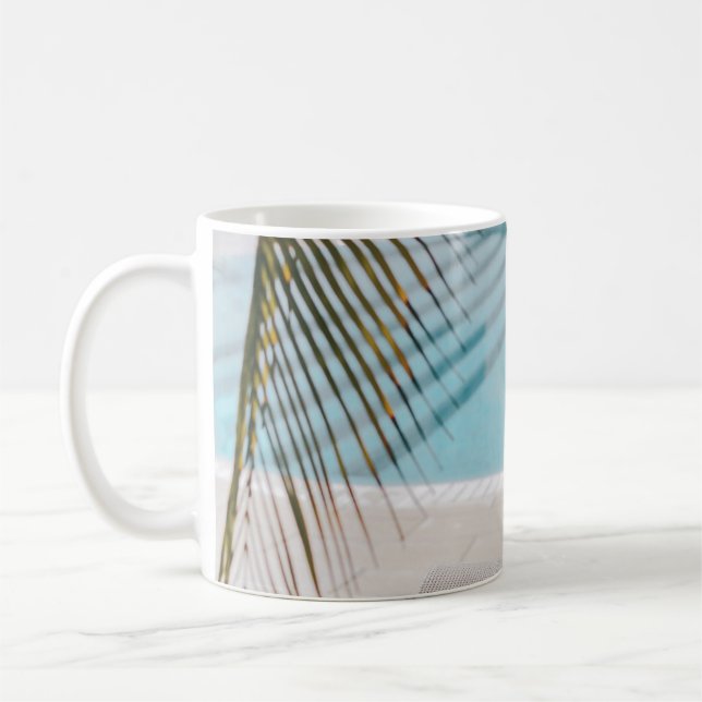 Brown and black armchair beside swimming pool in t coffee mug (Left)