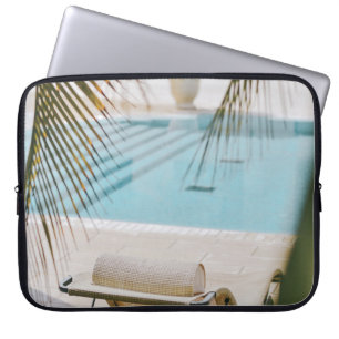 Brown and black armchair beside swimming pool in t laptop sleeve