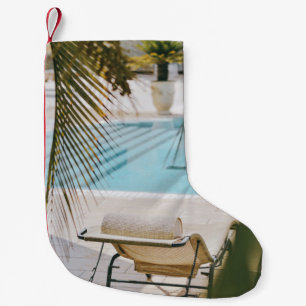 Brown and black armchair beside swimming pool in t small christmas stocking
