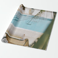 Brown and black armchair beside swimming pool in t