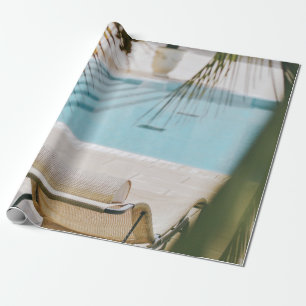 Brown and black armchair beside swimming pool in t wrapping paper