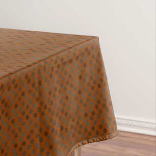 brown and bronze polka dots on orange rust tablecloth