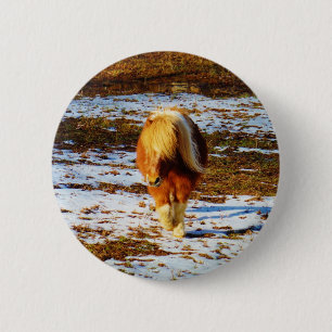 Brown and cream miniature horse in the snow. 6 cm round badge