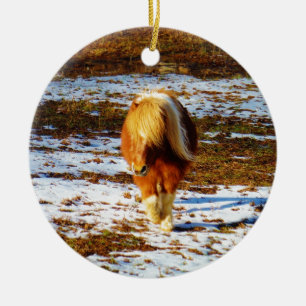 Brown and cream miniature horse in the snow. ceramic tree decoration