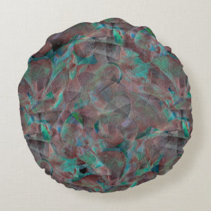 Brown and cyanish spots on unfinished wall plaster round cushion