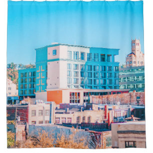 BROWN AND WHITE CONCRETE BUILDING UNDER BLUE SKY SHOWER CURTAIN