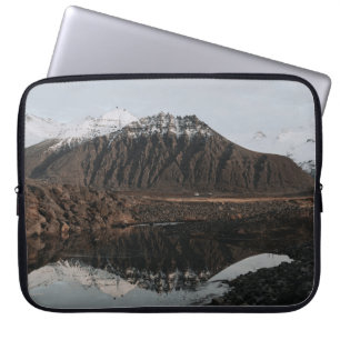 BROWN AND WHITE MOUNTAINS NEAR LAKE DURING DAYTIME LAPTOP SLEEVE