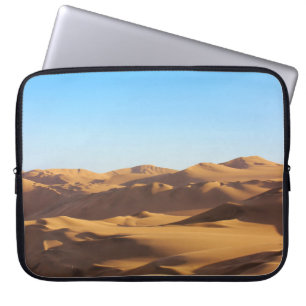 BROWN AND WHITE MOUNTAINS UNDER BLUE SKY DURING DA LAPTOP SLEEVE