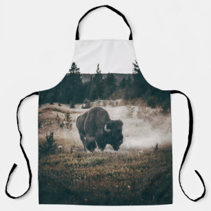 BROWN BISON ON BROWN GRASS FIELD DURING DAYTIME APRON