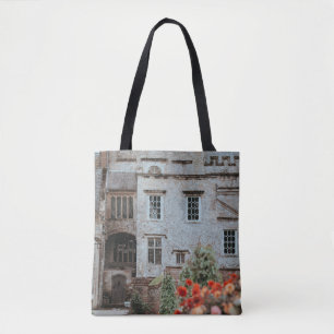 BROWN BRICKED HOUSE NEAR RED FLOWERS TOTE BAG