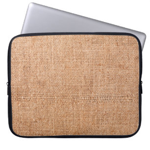 Brown burlap laying on white sheet. Abstract backg Laptop Sleeve