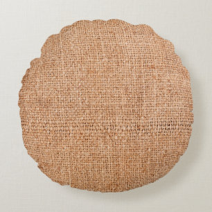Brown burlap laying on white sheet. Abstract backg Round Cushion