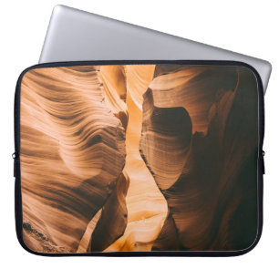 Brown cave under clear sky laptop sleeve