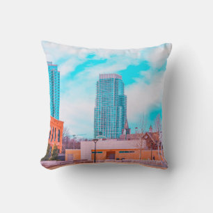BROWN CONCRETE BUILDING NEAR BARE TREES UNDER BLUE CUSHION