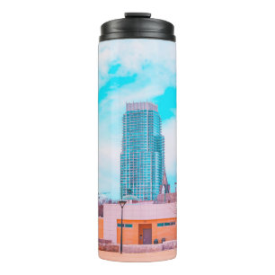 BROWN CONCRETE BUILDING NEAR BARE TREES UNDER BLUE THERMAL TUMBLER