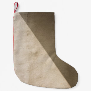 Brown concrete wall small christmas stocking
