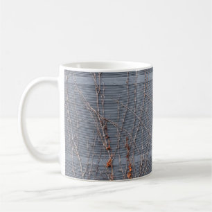 Brown dried leaves on water coffee mug