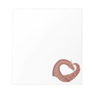 Brown heart dragon on white notepad