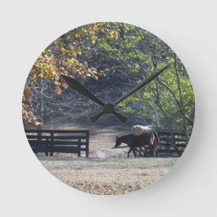 Brown Horse walking through Fence Round Clock