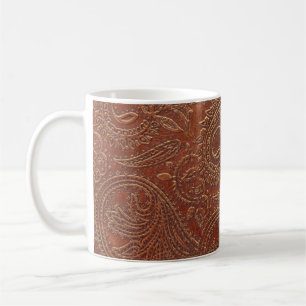 Brown leather, tooled floral pattern. coffee mug