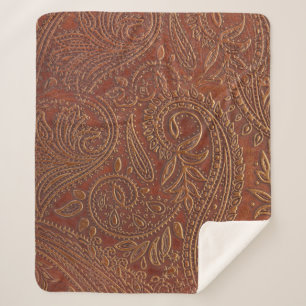 Brown leather, tooled floral pattern. sherpa blanket