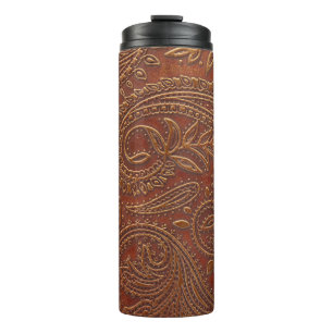 Brown leather, tooled floral pattern. thermal tumbler