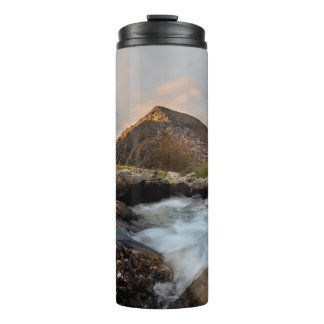 BROWN MOUNTAIN NEAR BODY OF WATER UNDER CLOUDY SKY THERMAL TUMBLER