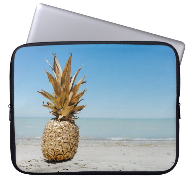Brown pineapple fruit on seashore laptop sleeve (Front)