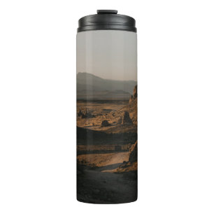 BROWN ROCK FORMATION ON BROWN FIELD DURING DAYTIME THERMAL TUMBLER