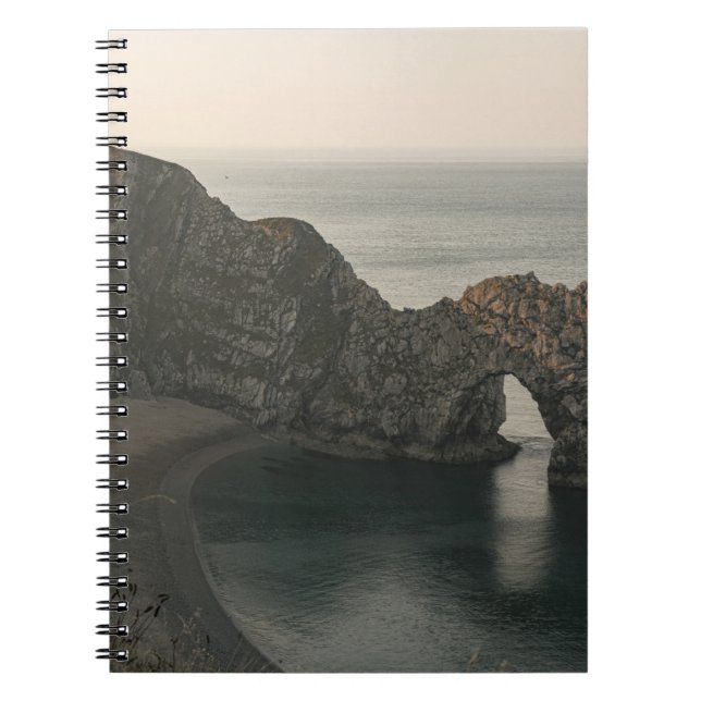 BROWN ROCKY MOUNTAIN BESIDE BODY OF WATER DURING D NOTEBOOK (Front)