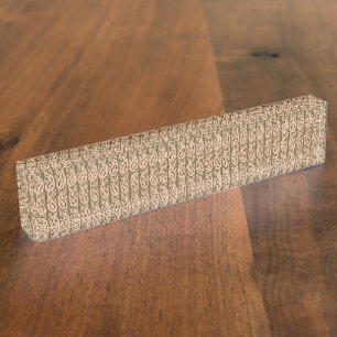 Brown rug featuring a detailed motif pattern with nameplate